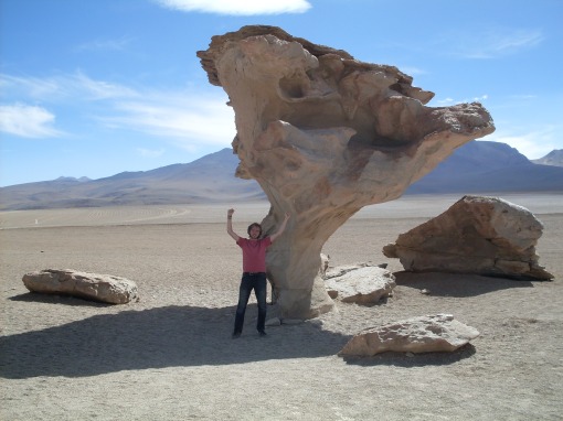 a big odd shaped rock with a big odd shaped human